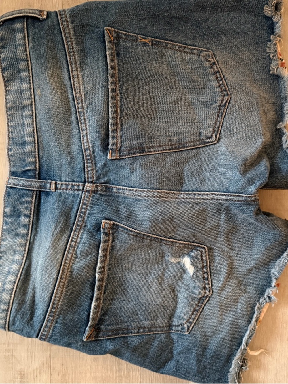 Express Distressed Denim Shorts with Floral Peek in Blue - Picture 2 of 4